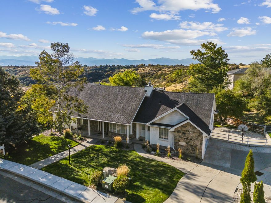 SELLER TO CONTRIBUTE UP TO $29,000 FOR BUYERS CLOSING COSTS OR RATE BUY DOWN!Tucked away in the sought-after Majestic Canyon Estates, this spacious 7-bedroom, 4.5-bathroom home blends the privacy of mountain living with the comfort of thoughtful design. With over 6,200 square feet of space on a .41-acre lot, this home is your personal retreat-so close to Little Cottonwood and Bells Canyon. Inside, you'll find vaulted ceilings, crown molding throughout, rich hardwood floors, and granite countertops. The open floorplan offers effortless flow, while oversized bedrooms and 9-foot basement ceilings provide the space and comfort your lifestyle demands. Outside, enjoy total privacy surrounded by mature trees, wildlife and the peaceful rhythm of nature. Yet, you're just minutes from world-class skiing, hiking, and everything the local canyons have to offer. Square footage figures are provided as a courtesy estimate only and were obtained from county records. Tax Parcel 28-11-455-015 is also included in this sale. Buyer is advised to obtain an independent measurement.