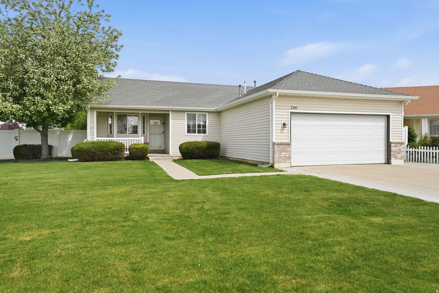 Welcome to this well-cared-for single-level ranch home in Layton! Sitting on a corner lot, this home offers an inviting front porch, mature landscaping, an open vaulted great room, a private primary suite, a fully fenced backyard, and an RV pad for extra parking. You'll also love the convenient location with walking trails like the Rio Grande, two nearby parks, a splash pad, a nearby fire station, and storage units close by-plus easy access to schools, shopping, and dining.