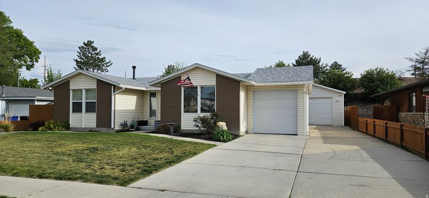 Great 3 bedroom 2 bath rambler in Taylorsville. The home boasts of a spacious detached 2 Garage with a shop area. Attached single car garage and RV parking. Downstairs has a spacious family room with a wood stove. There is a 4th bedroom downstairs 60% finished.  Large laundry room and cold storage. Close to everything ..shopping/schools. Square footage figures are provided as a courtesy estimate. Buyer is advised to obtain an independent measurement.