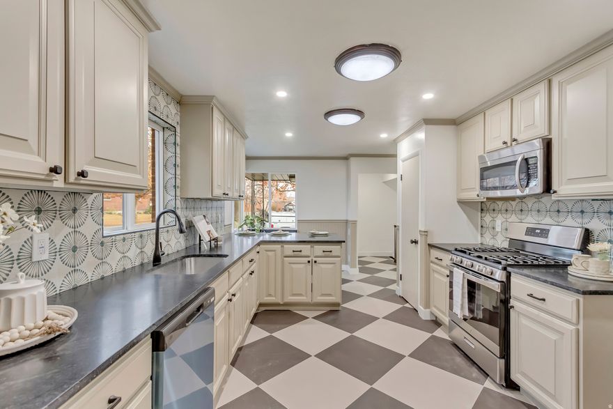 Discover this newly updated home tucked away in a charming Salt Lake City neighborhood. Bright and inviting, it offers a spacious, open layout filled with natural light. Enjoy a fully fenced backyard perfect for relaxing or entertaining, along with a detached two-car garage for secure parking and extra storage. A wonderful blend of comfort, style, and convenience in a highly desirable location.