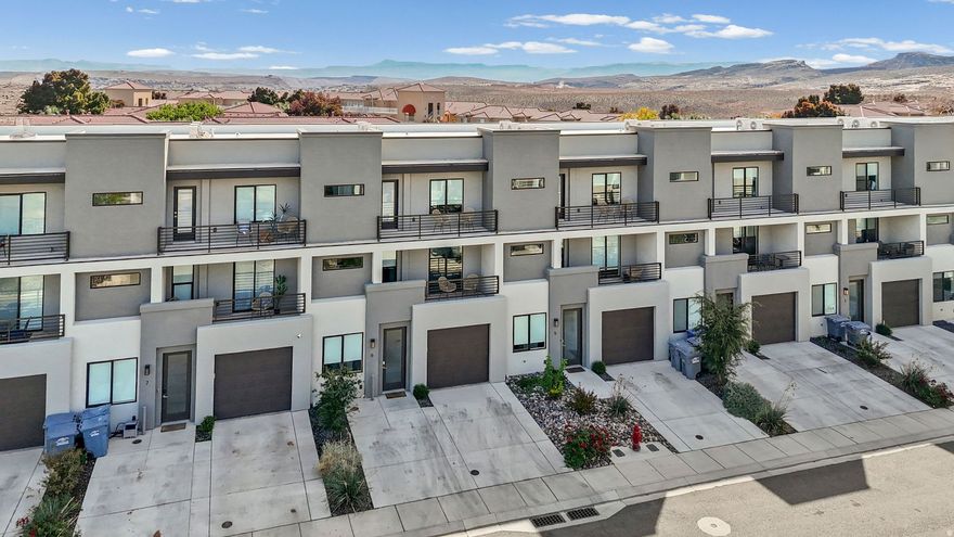 Welcome to The Vue at Green Valley, one of St. George's most desirable vacation-zoned communities! This beautifully furnished & turnkey townhome is ready to enjoy (or rent) immediately. Every detail is included: furniture, dcor, linens & all household supplies, making this an effortless investment or getaway. Designed for comfort and fun, this spacious residence sleeps up to 18 guests & features inviting indoor-outdoor living spaces, including a south-facing lower patio ideal for morning coffee & two north-facing covered decks perfect for sunset views and evening gatherings. Guests & owners alike will love the resort-style amenities...a sparkling pool & hot tub, pickleball/basketball courts & close proximity to world-class golf, hiking, biking & recreation throughout Southern Utah.