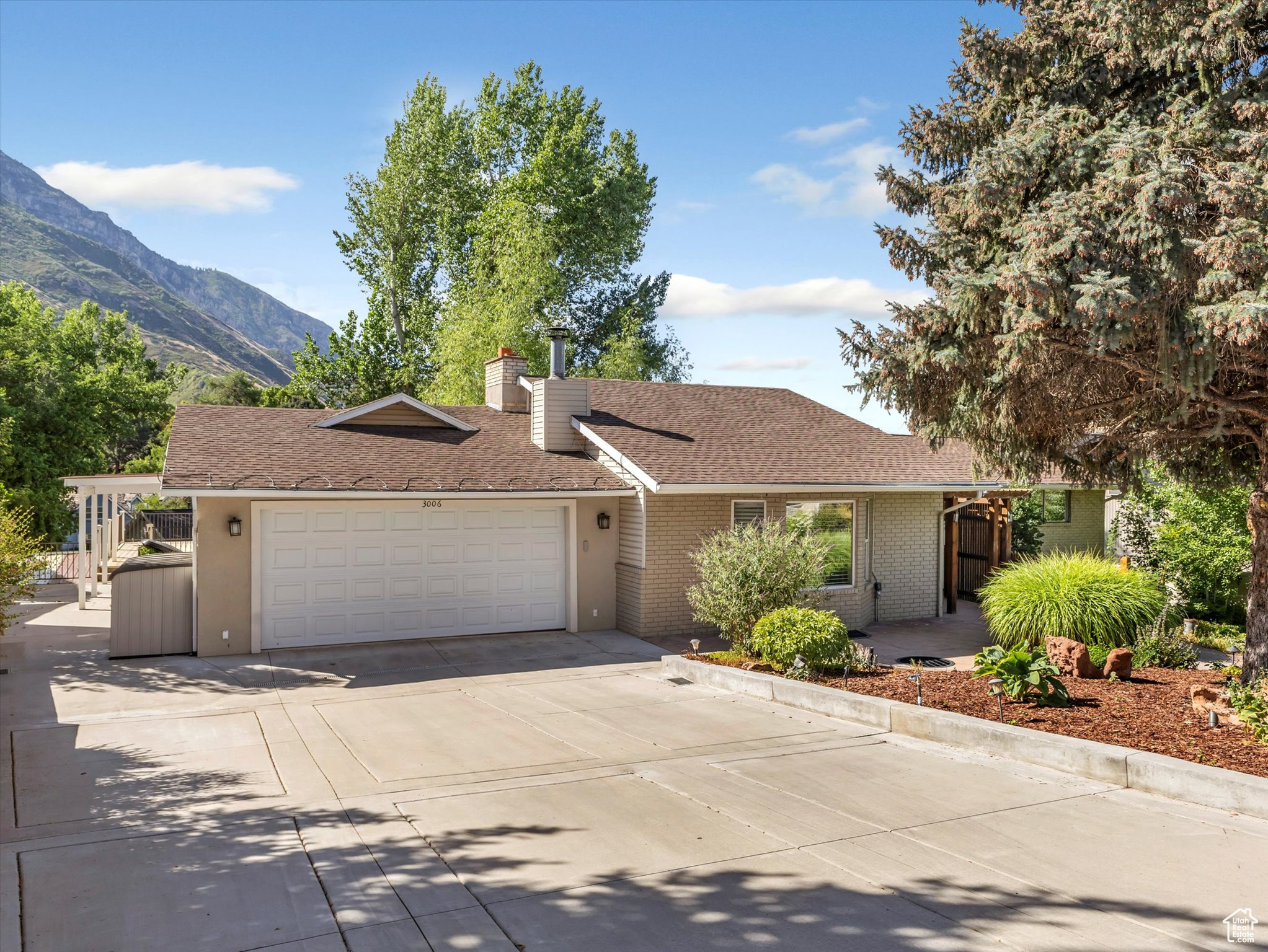 Tucked above Rock Canyon Park, this Provo rambler offers eye-popping mountain and valley views from vaulted ceilings and picture windows. Step onto the deck for sunsets over Utah Lake or wander into the trails just minutes away. A detached studio for creativity or calm. With space to grow and updates to make your own, this home has an unbeatable location, surrounded by $1M+ homes and nature's luxury! A rare find in a beloved neighborhood with plenty of room to create a mother-in-law suite or an ADU.