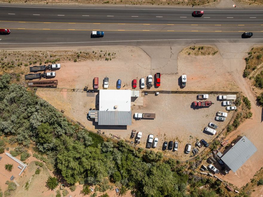 Commercial Opportunity with Highway Visibility & Rim Views in Moab!  ENDLESS POTENTIAL awaits with this exceptional highway commercial property located on the south end of town. Situated on 0.89 acres with commanding rim views, this high-visibility location offers outstanding exposure for a wide range of business ventures. With convenient highway access and an existing building already in place, this property is primed for immediate use or future expansion.  At the center of the lot is a 1,546 square foot commercial building, providing a strong foundation for your next enterprise. The structure includes a small office area ideal for customer interaction and a functional shop space that can be adapted to meet a variety of operational needs. Whether you're considering retail, food service, automotive, professional services, or childcare, the layout and lot size support flexibility and growth.  The generous parcel size allows for additional parking, outdoor use, or future development, making it easy to scale your business or enhance the customer experience-especially with the stunning surrounding views. This is a rare opportunity to secure a highway commercial property with both infrastructure and expansion potential in one of Utah's most sought-after markets.