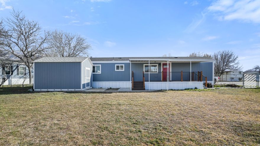 Welcome to the Blue Haven. Freshly painted and completely renovated inside, this Sandy gem offers the feel of a brand-new home. Enjoy a beautifully updated kitchen, new bathrooms, new flooring, every space thoughtfully designed. Step outside to one of the largest lots in the park featuring lush privacy bushes, fruit trees, a fantastic yard, and a custom pergola perfect for summer evenings and weekend gatherings. Turnkey. Private. Stylish. Homes like this don't come along often.