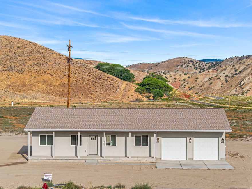 Brand New Home in Black Knoll Ranches  Nearly 1 Acre with Mountain Views! Welcome to your dream home in the scenic foothills of Sigurd, Utah! Located in the sought-after Black Knoll Ranches, this brand-new 3 bedroom, 2 bathroom home sits on a spacious 0.92-acre lot with stunning mountain views in every direction. Step inside and enjoy an open-concept layout with modern finishes, a full-size unfinished basement ready for your custom touch, and a dedicated cold storage room perfect for food storage or emergency prep. The home is heated with efficient natural gas and connected to culinary water. The 2-car garage offers plenty of space for vehicles, tools, or outdoor toys. Whether you're relaxing on the porch or planning your next backyard project, you'll love the peaceful setting and room to spread out. With unbeatable views, modern comfort, and room to grow, this is the perfect place to plant roots in central Utah.