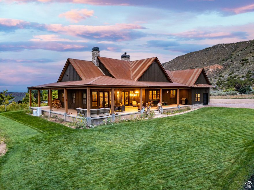 Welcome to the iconic Wolf-Raven Ridge.  Inspired by the timeless architecture of Jackson Hole, this Dry Fork Canyon estate is more than a home-it's an experience. From the moment you enter Dry Fork Canyon, there's a sense you've arrived somewhere extraordinary, where mountain air mixes with the scent of pine and the views open wide to the Sawtooth backdrop with wilderness stretching out in every direction, surrounded by the vastness of National Forest and BLM lands. Set on over eight acres, the property blends privacy and freedom with a level of craftsmanship and detail that can only come from a fully custom build. The approach begins at the covered porch framed by Amish-crafted timbers, and inside you're welcomed by soaring 20-foot vaulted ceilings, knotty alder beams and cabinetry, and fireplaces anchored with stones hand-selected from Ashley National Forest. Every space has been designed not just to impress but to create moments of connection and comfort, from the chef's kitchen with Sub-Zero fridge, Caf Series appliances, custom copper-trimmed hood, hidden walk-in pantry, and pine tongue and groove accents, to the subtle glow of hidden lighting and the discovery of a secret bookcase hutch. The master suite is its own retreat with a freestanding tub, steam shower, and custom built-ins, while the home's systems quietly deliver efficiency and reliability with dual heat pumps, 95%+ furnaces, tankless water, and a 1,000-gallon propane supply. Step outside to a stamped patio for evenings under the stars, a 2,000 square foot insulated shop with pass-through garage doors, and grounds that include horse facilities, a chicken cabin, gardens, and groomed walking trails. Wolf-Raven Ridge is a property that makes a statement yet feels deeply personal-crafted with integrity, rooted in vision, and set in a location that simply cannot be replicated. Nothing like it has ever been offered in the Uinta Basin, and nothing else will capture your imagination in quite the same way.