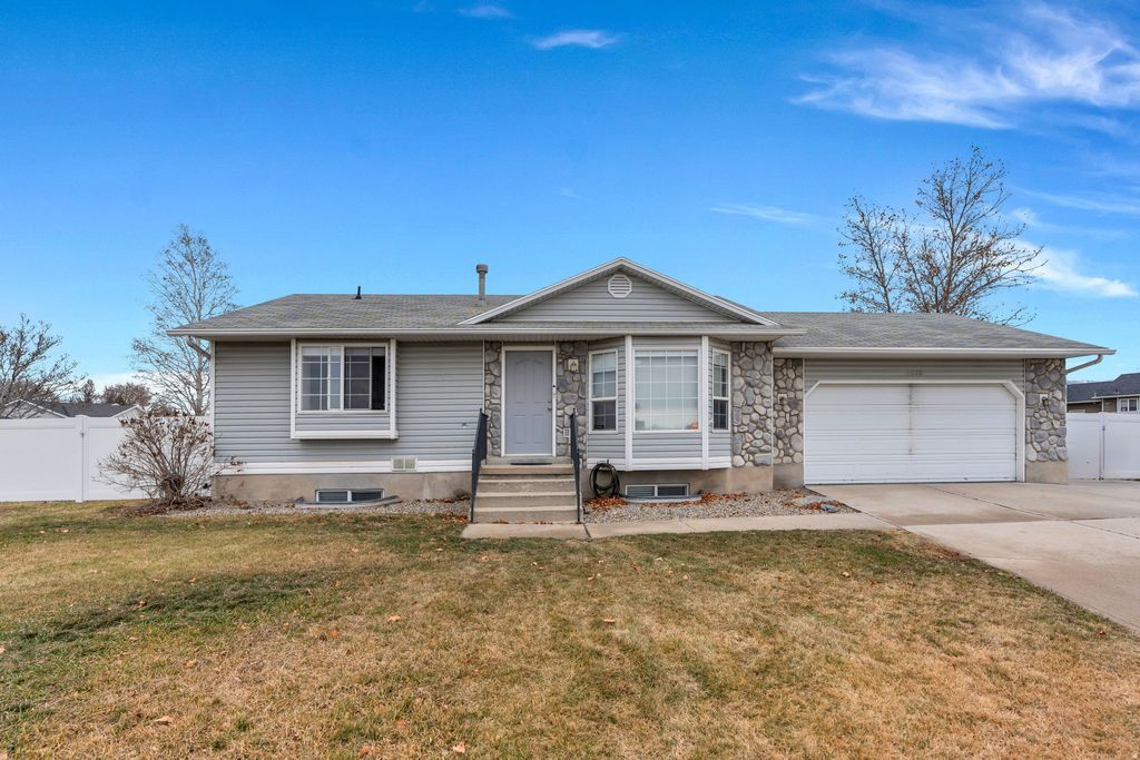 Photo of 6073 W EAGLES PEAK CV S, West Valley City, UT 84128 (MLS # 2136414)