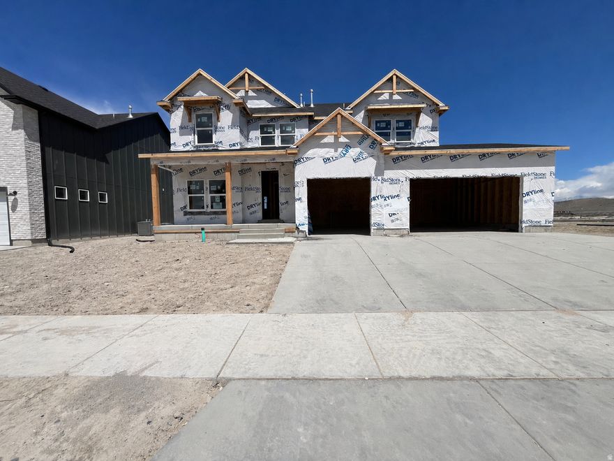 Don't miss out on this fully finished home that has been upgraded throughout with over $140,000 in options including: Gourmet kitchen - Quartz countertops - Gourmet backsplash - Upgraded cabinets - 3rd car garage - 9' ceilings on the main - Farmhouse elevation - Classy gold fixtures - LVP throughout main floor - Finished basement - Upgraded carpet and LVP. With mountain views and situated in a quiet and desirable community, this home is a must see! Close to restaurants, shopping and schools. Enjoy the community amenities: pool, clubhouse, playground and internet. Estimated completion is July 2026. *Ask about our preferred lender incentives to help you get into your dream home*