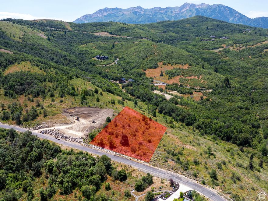 Build your dream mountain retreat on this premier lot within the exclusive, gated community of Hawkins Creek. Positioned above Ogden Valley, the homesite captures breathtaking views of Pineview Reservoir and the iconic peaks of Powder Mountain, Ben Lomond, and Lewis Peak. Backing onto preserved open space, it offers unmatched privacy and a serene natural setting. A completed geotechnical study further streamlines the path to construction.  Tucked just off the scenic and historic Old Snowbasin Road, this coveted location grants effortless access to Snowbasin Resort, Anderson Cove's boat launch, and an extensive network of hiking, biking, and ski trails. Hawkins Creek was thoughtfully developed with protective covenants and a strong commitment to preserving the area's natural beauty. Residents enjoy nearly 80 acres of open space and a private trail system designed for year-round outdoor adventure-including hiking, biking, and horseback riding.  Whether you're seeking solitude, recreation, or a basecamp for all-season living, this exceptional lot offers a rare opportunity to build in one of Northern Utah's most treasured mountain communities. *All property information, boundaries and documents to be verified by buyer.