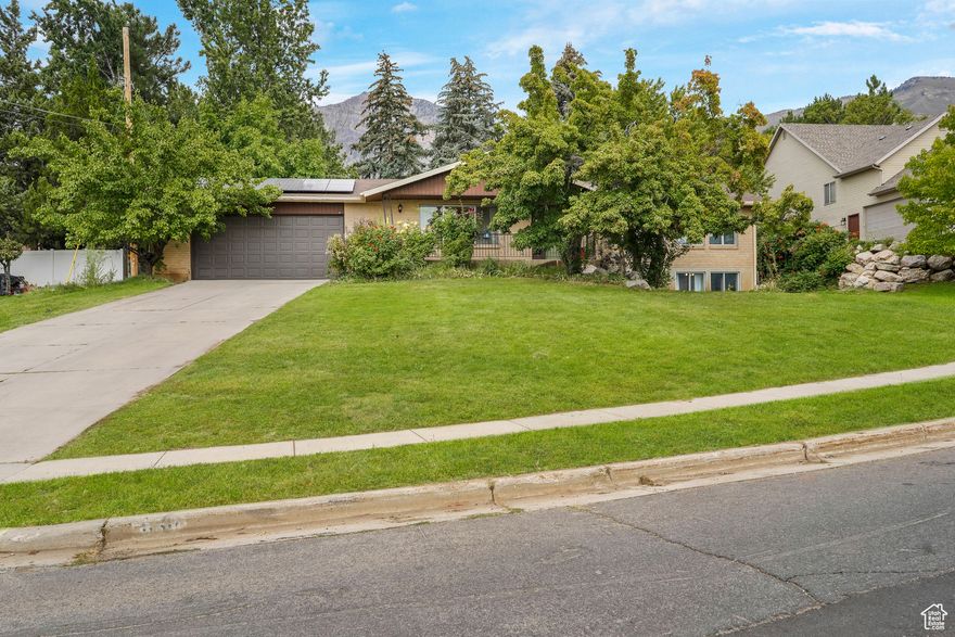 Enjoy Elevated Living in this spacious rambler with stunning panoramic views! This magnificent residence is situated in a prime area and has expansive views of the shimmering city and the majestic mountains. Enjoy the fireworks all over Ogden from your driveway during 4th of July! Boasting a large half-acre lot with a beautiful backyard with trees providing shade, covered porch to host BBQ's, and solar power making your electric bill affordable.  Updates include fresh paint throughout the main living area that is light and airy.   Make an appointment for your showing right now!  Square footage figures are provided as a courtesy estimate only and were obtained from County.  Buyer is advised to obtain an independent measurement.