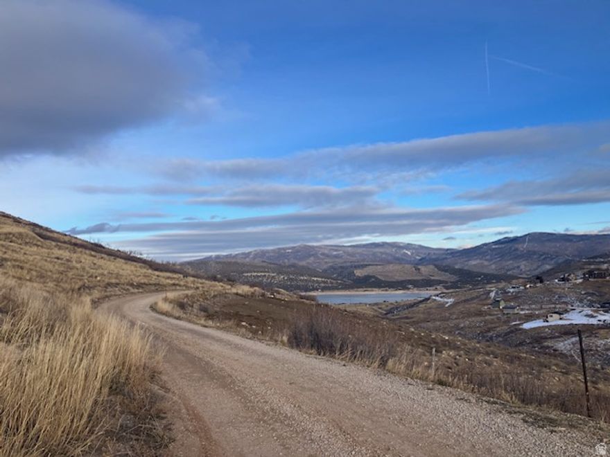 Get out of the city congestion and smog and enjoy the great outdoors on this 20.05 acre view lot. Views in the distance Deer Valley and Promontory next door! Located in a gated community for total privacy Possible shared water agreement with lots 45,46. Year-round access! . Zoning allows one cabin with no size restrictions and 1 ADU up to 1000 sq ft of livable space. Electrical service is nearby for easy connection. Wooded area with active wildlife, Driveway and buildable pad. in place with a large buildable area directly off Kent Canyon Road. Close to electrical. Share water with lot 45,46. Water rights secured with Weber Basin District, driveway with building pad ready to build. Buildable pad approx. 2.46 acres. The upper section of the lot offers panoramic mountain and valley views with a stunning overlook of Rockport reservoir expansive mountain ranges and the high Uinta's. Within minutes of Rockport State Park for fishing, boating or paddle boarding. Bring your camper, water toys and ATV's and enjoy the wonders of nature. Only 45 minutes from Salt Lake and 20 minutes to Park City for shopping, dining, entertainment, skiing and golf. Seller has paid the fee to protect water rights. SHOW ANYTIME. Perc test just completed 9/2025, good to go. GPS Coordinates   4046'15"N 11125'15"W