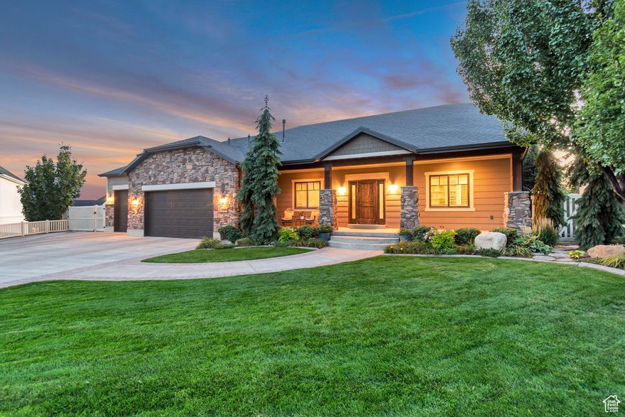 Welcome to this spacious, custom rambler in the heart of American Fork! Thoughtfully designed and beautifully finished, this home features gorgeous custom details, generously sized rooms, and inviting open-concept living spaces. The main level includes three bedrooms and two-and-a-half baths, including a private primary suite with a large walk-in closet, and a spa-like bath with separate tub and shower. You'll love the large kitchen with a walk-in pantry, abundant cabinetry, and plenty of counter space-perfect for everyday living and entertaining. The oversized dining area flows seamlessly into the cozy family room which features a gas fireplace, tall ceilings and large windows that create an airy, welcoming feel.   The lower level offers incredible flexibility with a separate entrance, a second kitchen (finished and plumbed for cabinetry and appliances, ready for your personal touch), a second laundry, a theater room, a spacious bonus room, two additional bedrooms, a full bath, and a large storage area complete with shelving.  Outside, you'll love the inviting outdoor spaces including a covered patio overlooking a private backyard that backs up to native open space-ideal for relaxing or entertaining. Enjoy evenings around the firepit, a built-in play structure, fruit trees, a vegetable garden, and lush mature landscaping. With a 3-car garage and RV parking, this home truly has it all.  Whether you're relaxing on the patio, entertaining friends, or simply enjoying the serenity of the setting, this is the kind of home you'll love coming back to every day.  Call today to schedule your private showing and experience it for yourself!  Square footage is provided as a courtesy estimate only and was obtained by county records. Buyer is advised to obtain an independent measurement.