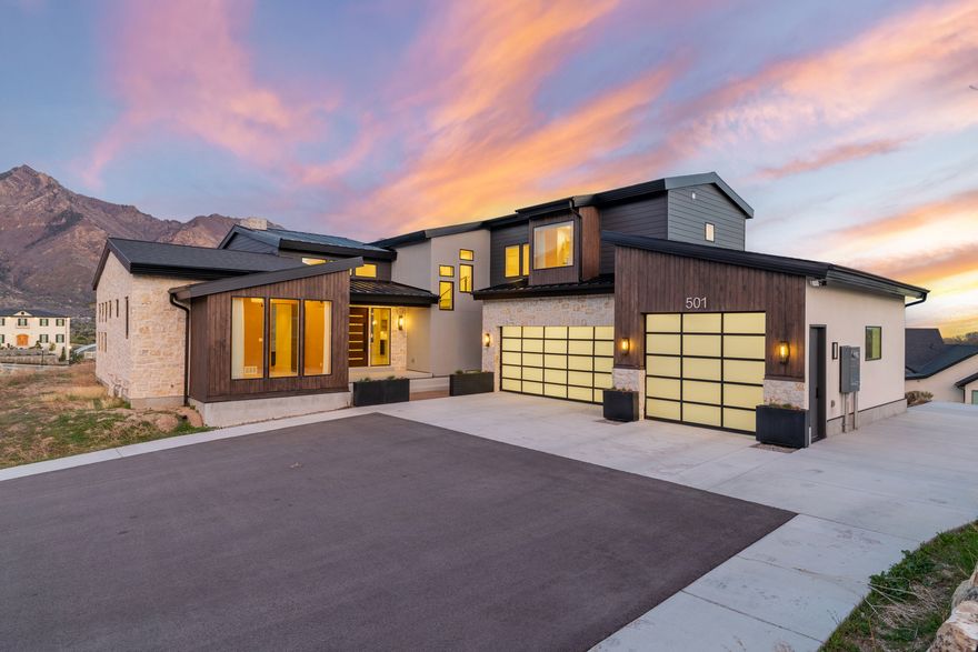 An absolute masterpiece custom home in one of the most prestigious neighborhoods in Alpine! Rarely do estates like this hit the market. Enjoy professionally designed finishes paired with breathtaking balcony views of the Wasatch Mountains and Utah Lake. You'll love the unique luxury upgrades, including switchable smart glass windows in the primary bath, massive 10-foot sliding glass doors in the vaulted-ceiling living room, engineered hardwood flooring, high-end stone, and threebeautifully craftedfireplaces. Designed to be the "fun home", the property offers a space that can be customized to the buyer's preferences, such as a home gym, golf simulator room, or theater room. It also includes a .46-acre yard that has a pool and room for a pickleball court. If you're looking for a one-of-a-kind luxury home in an incredible neighborhood, call or text the listing agent anytime to schedule a tour!