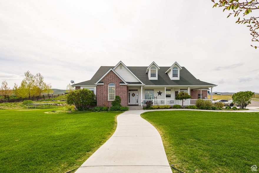 Enjoy sweeping valley and mountain views from this 1.36-acre home with a large, detached garage/barn - an ideal horse property. Inside, you'll find a welcoming entry, formal living room, and a bedroom suite. The open great room flows into the dining area and bright kitchen, perfect for gatherings. The basement offers plenty of space for games or hobbies. Two master suites feature jetted tubs and walk-in closets. Conveniently located near I-15, this home offers the best of country living with modern comfort. Don't miss it-schedule your showing today! Water share with RNG water company.  School bus stops at the front door. Only a 15 minutes drive to Logan. New Super Target getting built 15 minutes away.  5 minutes from world famous crystal hot springs. 1 mile from I-15 entrance.  1 hour from salt lake city.