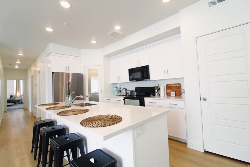 Beautifully maintained 1258 sq ft condo in the heart of American Fork! This inviting unit features an open-concept layout with abundant natural light, creating a warm and welcoming atmosphere. The kitchen offers ample cabinet space and flows seamlessly into the living and dining areas, perfect for everyday living or entertaining. 3 Spacious bedrooms and 2 bathrooms provide comfort and functionality. Enjoy resort-style HOA amenities including a pool, parks, pickleball courts, and scenic walking paths. The HOA also covers water, sewer, trash, and snow removal, making for easy, low-maintenance living. Conveniently located near American Fork shopping, dining, parks, and easy freeway access. Ideal for first-time buyers, investors, or anyone seeking low-maintenance living! Buyers agent to verify information. Option to purchase with furniture! Please note, the condo is currently occupied. Please give us 24-48hrs notice for showings. Thank you!