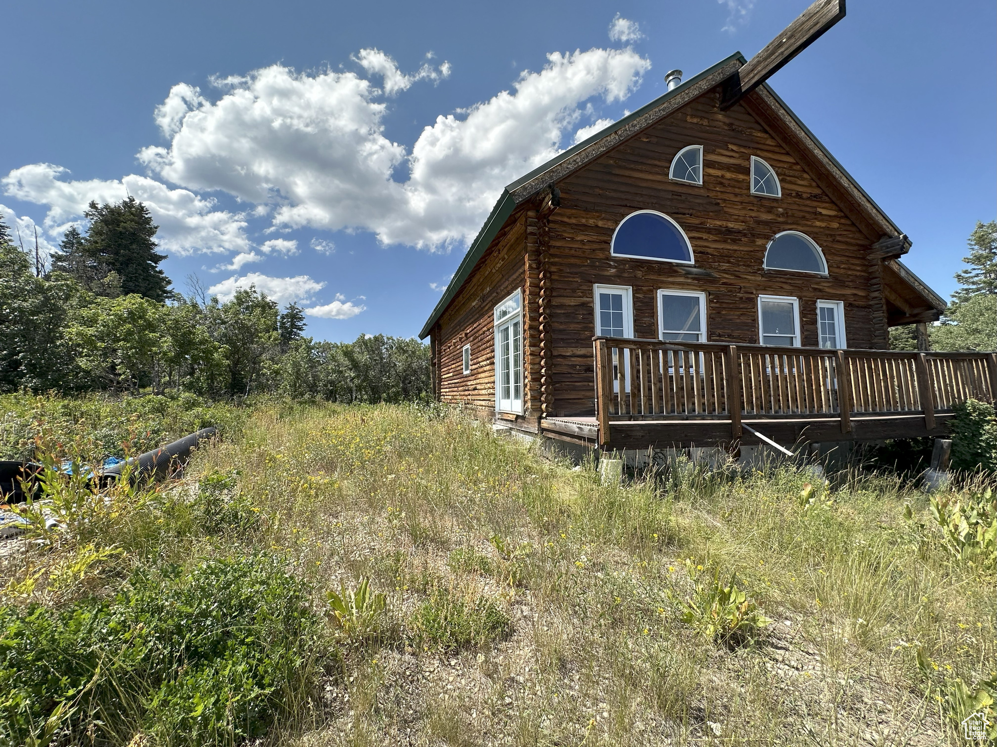 Great valley and mountain views. Unfinished cabin with some building materials left inside, plenty of room for 4 bedrooms, 3 bathrooms and family rooms, wrap around deck, covered balcony. Dead end street Square footage figures are provided as a courtesy estimate only and were obtained from county . Buyer is advised to obtain an independent measurement.