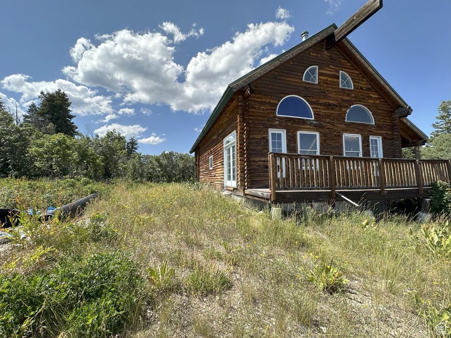 Great valley and mountain views. Unfinished cabin with some building materials left inside, plenty of room for 4 bedrooms, 3 bathrooms and family rooms, wrap around deck, covered balcony. Dead end street  Square footage figures are provided as a courtesy estimate only and were obtained from county .  Buyer is advised to obtain an independent measurement.