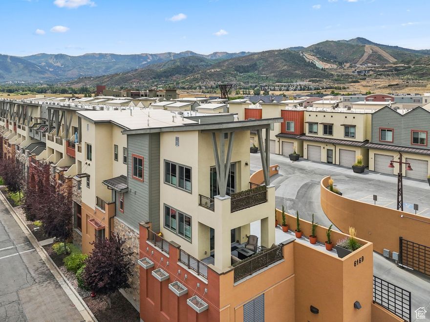 Perched at the row's end and overlooking the Swaner Preserve, this townhome nails the balance of mountain retreat, smart investment, and everyday convenience. It's one of the only units with a patio this large-over 675 sq. ft. of outdoor living-where you can catch sunrises over the wetlands and sunsets on the Park City ridgeline.  Offered fully furnished and turnkey, the layout is built for flexibility. A main-level suite with oversized patio access anchors the home, while upstairs the kitchen and great room open seamlessly onto a second patio. Two additional bedrooms with connecting ensuite, plus a full bath for guests, round out the space.  The private garage comes with secure heated storage, perfect for your skis after the slopes or mountain bikes in the summer. Step outside and you're in the heart of Newpark -locals love Hearth and Hill, the coffee shops, gyms, and trails all just downstairs. World-class skiing is minutes away, and Salt Lake City is an easy 25-minute drive.  Whether it's your full-time base, a weekend escape, or an STR workhorse, this end unit delivers rare outdoor space, walkable convenience, and views you won't find elsewhere in Newpark.