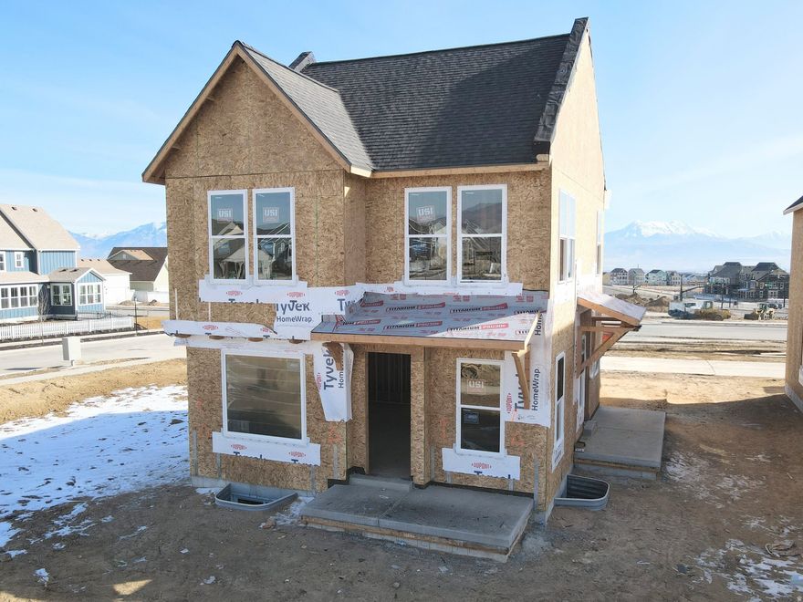 Brand new home under construction featuring a finished basement, full side and backyard landscaping, and designer interior upgrades throughout! This home offers 9-foot ceilings on every level, a grand primary suite, and a versatile loft on the second floor. Stylish details include metal railings and upgraded kitchen cabinetry extending to the ceiling. The thoughtfully designed floor plan features a spacious living room with a cozy fireplace, seamlessly open to the dining area and kitchen with a large island, perfect for entertaining. A generous walk-in pantry and conveniently located powder room are tucked just off the two-car garage. Price includes all designer upgrades and options! Estimated Summer 2026 Completion *Interior finished photos are of similar plan for example purposes. Upgrades and finishes will vary*