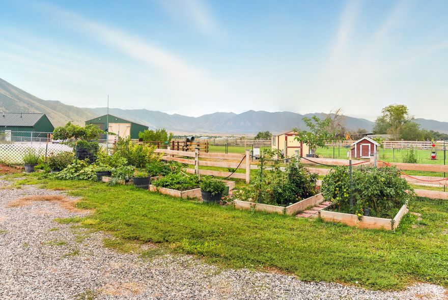 MOTIVATED SELLER. Don't miss this while it's still available! A fully updated 2,568 sq ft, 4-bedroom, 2-bath home on 1 acre in the heart of the Tooele Valley. New windows throughout, HVAC System, custom kitchen cabinets. Upstairs you'll find a remodeled bathroom, basement is newly remodeled to include a beautiful Mother-in-law suite or rentable apartment for extra income. It has a full kitchen and bathroom downstairs with a private entrance. Outside you'll enjoy endless possibilities to have a mini farm. From goats to chickens you get a fully enclosed split pasture with a 12x12 barn, chicken coop and water hydrants ready to go. The shed and shipping container are great for storing hay and all your farm tools and equipment. A newer septic system, 1.69 acre-feet of water shares included as well as shared well water for culinary use. Huge Walnut tree for shade so you can enjoy the unobstructed view of Pine Canyon and Oquirrh Mountains. Peach, Plum, Apple, Fig, Elderberry, Cherry and Almond tress will provide delicious fresh fruit for your family. You'll enjoy endless Raspberries and the 7 raised beds wil give you ample space to grow all the veggies you need. Easy access off and on the main road and only minutes to Tooele Shopping, Stansbury Park Golf Course and Salt Lake City Airport. Use our Preferred Lender to receive a free 1-0 buy down. Welcome to your modern farmhouse oasis. Come start your dream today.