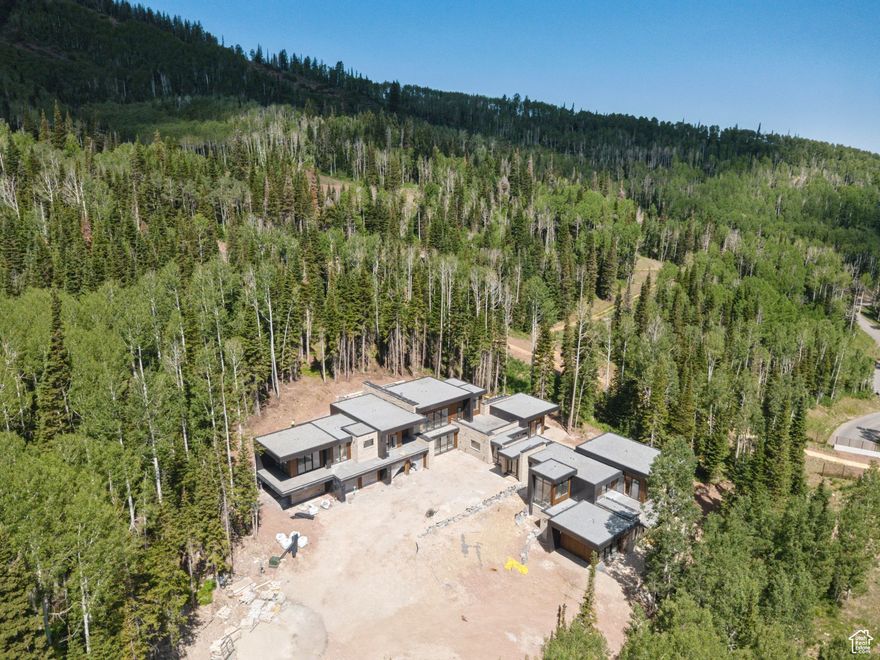 314 White Pine Canyon is the latest creation from the incredible team at 4C Group. This spectacular home is currently under construction and slated to be completed in Fall of 2025. As you pull up the driveway into the heated motor court you are greeted by an expansive glass breezeway that provides a dramatic entry whileconnecting the different wings of the house and providing a natural link to the beautiful outdoor surroundings.Thehome spans 10,756 square feet and includes two primary bedroom suites, and additional three guest suites plus a dedicated bunk room. The aesthetic of the home is contemporary combined with warm tones and materials that create a beautiful space that is harmonious with the mountain environment. The main floor of the home includes a generously sized great room with walls of glass that incorporates the kitchen, main living area, and dining room. The kitchen includes two pantries making sure there is plenty of space for entertaining large groups of family and friends. The main floor also includes the primary bedroom suite, glass partitioned office, mudroom, and an oversized four car garage. The upper level is all about fun with a large second living area with room for billiards and games. You will also find a ski room with individual gear lockers that opens directly onto a heated patio with fire pit that flows out to the adjacent No Name ski run. The upper level also includes an exercise room with aprivate treatment room, cedar sauna   and steam shower. In addition to the ski room patio, there is a roof top patio with panoramic views of the surrounding mountain peaks. In fact, the home has over 6,200 square feet of heated patios. The home includes two oxygenated primary bedrooms plus preparations to expand the system to all six bedrooms. Please reach out for more information on the extensive list of amenities and features included in this outstanding property.
