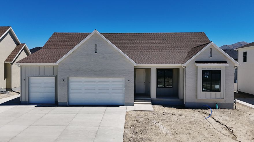 The Autumn floorplan in Sage Park on a West Facing Lot! This highly sought-after rambler offers 3 spacious bedrooms and 2 1/2 bathrooms all on the main level, with a smart, open-concept design and upgrades throughout. Step into the massive great room featuring 12-foot ceilings and a gas fireplace, oversized windows, and seamless flow into the gourmet kitchen with quartz countertops, a gas range, and beautiful finishes throughout. 9-foot ceilings on the Main level, The luxurious primary suite features a vaulted ceilings, a spa-like bathroom featuring a separate soaking tub and walk-in shower, double sinks, and a large walk-in closet. Don't forget the 9' basement with entrance for future ADU.