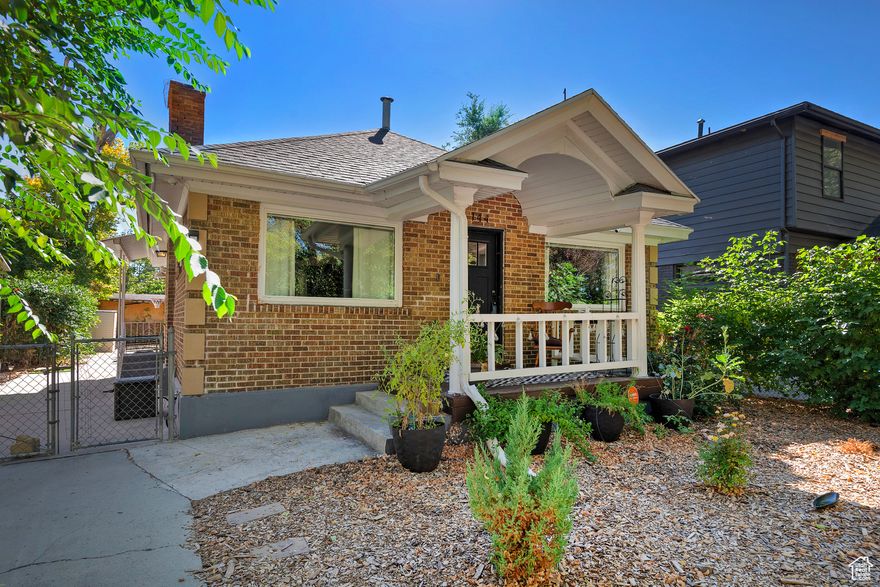 Beautiful all-brick bungalow situated on the east side of downtown Salt Lake City. This charming home is within easy strolls to a variety of many restaurants, entertainment, and shopping, with Liberty Park just a couple of blocks away. A short drive to the University of Utah adds to the convenience. Home sits on a nice-sized lot, featuring a fully fenced private backyard and a covered patio-perfect for entertaining family and friends. The front porch overlooks a peaceful, tree-lined street, adding curb appeal and a welcoming ambiance. Inside, the home has been updated for modern living and includes all appliances along with a washer, dryer, and refrigerator for immediate move-in. Don't miss the opportunity to make this delightful bungalow your new home.