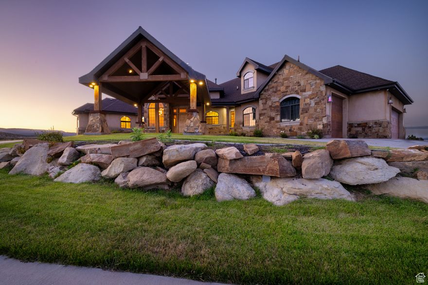 Discover a rare opportunity to own a magnificent estate in Vernal, where luxury meets tranquility! Step inside to find an abundance of natural light that floods the expansive living spaces, enhanced by high ceilings and elegant hardwood and tile floors. The gourmet kitchen is a culinary enthusiast's dream, featuring granite countertops and top-of-the-line stainless steel appliances, all set against the backdrop of vaulted ceilings, recessed lighting, and gorgeous views. Outdoor living takes center stage with a covered balcony, ideal for entertaining or simply enjoying the breathtaking views that surround you. Each room in this home has been thoughtfully designed with custom built-ins and modern finishes that exude sophistication. The luxurious master bath offers a spa-like retreat, while walk-in closets provide the ultimate convenience. A dedicated loft allows for extra space without sacrificing comfort. The finished basement offers additional living space, bedrooms, bathrooms, a second kitchen, and a home theater (that could be a bedroom) perfect a basement apartment (with it's own entrance), or extra space for you or your guests. The 360 degree views from the large picture windows, balcony, and porch absolutely speak for themselves. Sit back and enjoy the New Years and 4th of July fireworks, and relax as you watch the Dinah Soar Days hot air balloons fly high from the comfort of your home. Schedule a private tour today and immerse yourself in luxury living. Square footage per previous appraisal. Property boundaries in photos are an estimate only.  Buyer to verify all information.