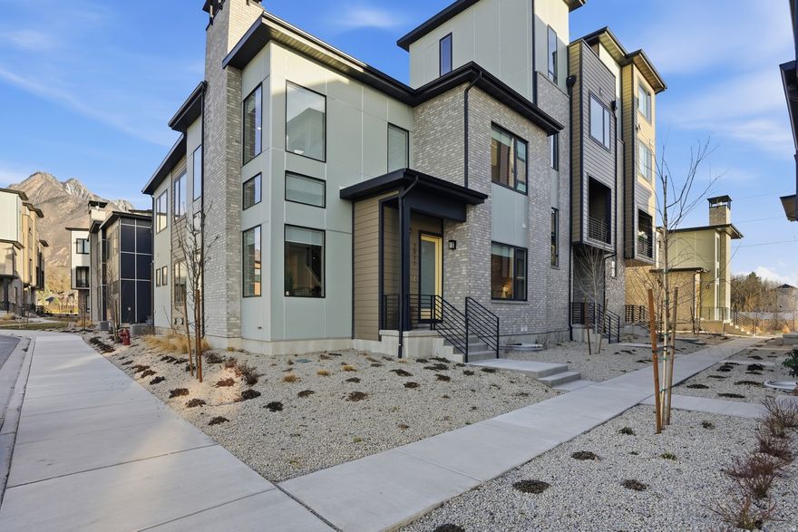 Turnkey luxury in Holladay Hills with over $290K in upgrades. Rare A-unit exterior floor plan with only one shared wall and true main floor living including primary suite, kitchen, dining, and laundry. Designer kitchen with JennAir appliances, Taj Mahal quartzite countertops with waterfall island, and porcelain tile backsplash. Open-concept living with custom finishes and abundant natural light throughout. Custom shades on every window wired and set up on automatic controls. Upper-level loft with adjacent fitness room and direct access to rooftop deck with fireplace, seating, and BBQ area which is perfect for entertaining or relaxing. Private EV charger in garage. Effortless lock-and-leave living at its finest. All furnishings included and ready for you to enjoy. Figures are provided as a courtesy, buyer and buyers agent to verify all information.