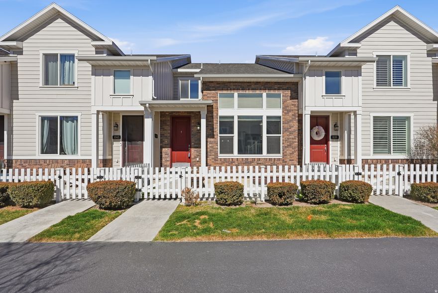 Welcome to this beautifully maintained townhouse in the desirable Westgate subdivision in Bluffdale, featuring the popular Astoria floor plan by Holmes Homes. Conveniently located near Point of the Mountain with quick access to I-15 and Lehi, this home offers comfort, functionality, and a fantastic location. Step inside to impressive vaulted ceilings that create a bright and open feel throughout the main living space. The open-concept main level is perfect for everyday living and entertaining, featuring large bay windows that bring in abundant natural light. The kitchen offers quartz countertops, a gas range, stainless steel appliances, updated lighting, and durable LVP flooring, combining style and practicality. Upstairs features a convenient laundry area with washer and dryer included, along with two spacious primary suites, each with its own private en-suite bathroom. One of the suites includes a dual vanity, providing added comfort and functionality. The fully finished basement adds valuable living space and flexibility with a large area that can easily serve as a third bedroom, family room, office, or flex space, along with a full bathroom and a spacious mechanical/storage room. The home has been extremely well cared for and features brand new carpet throughout, while the main level offers LVP flooring and the bathrooms feature tile flooring for durability and style. Step outside to enjoy a fully fenced private patio, perfect for relaxing or entertaining. The community also offers a nearby park with a swing set and basketball hoop, adding to the neighborhood's appeal. Move-in ready and priced to sell, this home is a fantastic opportunity in a prime Bluffdale location close to shopping, dining, and major commuter routes. **TO VIEW FULL MOTION VIDEO OF THIS HOME PRESS THE TOUR BUTTON***THIS HOME IS FEATURED ON TELEVISIONS REAL ESTATE ESSENTIALS ABC4 UTAH SUNDAYS AT 4:30PM *** Square footage figures are provided as a courtesy estimate only. Buyer is advised to obtain an independent measurement & verify all info.