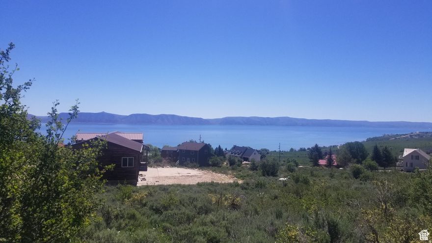 Great corner lot with amazing views of Bear Lake and a nice gradual slope. The lot is just minutes away from Bear Lake West amenities that include a swimming pool, hot tub, discounted golf, beach access, tennis/pickleball courts, and a restaurant. The lot has great 2 street access in an established and developed neighborhood. See additional information at: bearlakewest.com Information deemed reliable, buyer to verify. Seller Financing available. Contact listing agent for details.