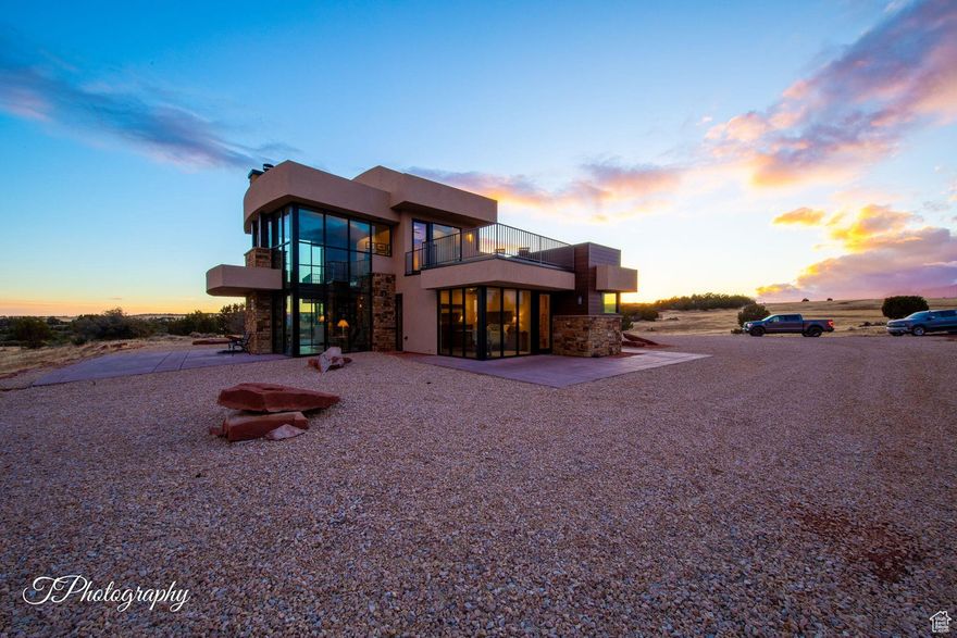 I am speechless-this is one of the most amazing properties in my 30+ years. A once-in-a-lifetime turnkey home with breathtaking views of Kolob Cliffs and Zion National Park, just 5 miles away. Sitting on 150 acres of pristine land, with potential for two additional 2-acre lots (water & septic in place). Total privacy-no homes in sight, fenced on 3 sides with Gorge/BLM on the other. Only 25 miles from Hurricane with full services. Fully self-contained: private spring with 45,000-gallon storage, 1,000-gallon propane tank, KOHLER backup generator, Mitsubishi Mini Splits, Smart Central Heating, solar panels, satellite internet, and a large stove heating the home. Side-by-side negotiable. Appointment requires verifiable funds.