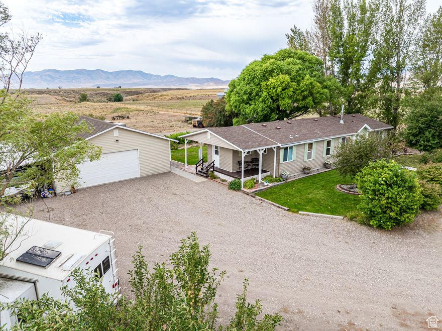 Welcome to country living at its best! This 4 bedroom, 2 bath home sits on 22+/- acres outside of Malad, ID. Detached 2 car garage with carport and horse corral. Surrounded by open views, the property offers peace, privacy,and room to spread out. The home features a comfortable layout with spacious living areas, a bright kitchen, and plenty of storage. Outdoors, acreage provides endless possibilities-whether for horses, livestock, hobby farming, or simply enjoying the space. Recreational opportunities are all around you, with nearby mountains, trails, and reservoirs offering hunting, fishing, hiking, and riding. Located within easy reach of I-15, this property combines rural seclusion with convenient access to town. A rare chance to own a move-in ready home with acreage in a beautiful Idaho setting!