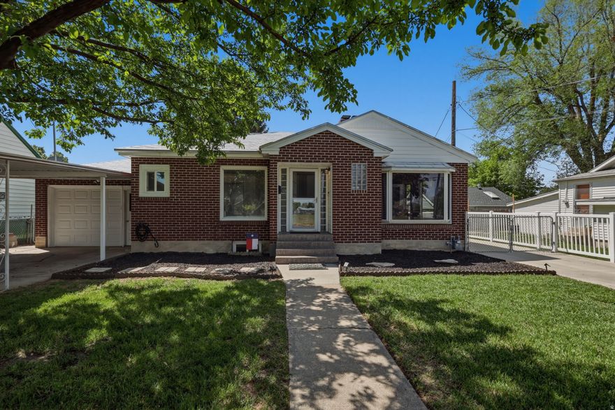 This all-brick charmer is as cute as they come and has the kind of warmth and personality that instantly feels like home. Thoughtfully updated throughout, the home features a beautiful kitchen with newer appliances, big picture windows, refreshed flooring, and inviting spaces designed for both comfort and style. With 4 bedrooms and 2 spacious family rooms, there is plenty of room to live, gather, and relax. Outside, you'll love the great yard and ideal location, paired with rare extra parking that includes two driveways, a carport, and a garage. Whether you have toys, guests, or just appreciate the convenience, this setup is hard to find in this price range. Even better, this home offers true peace of mind. The seller has completed a pre-listing inspection and taken care of the repairs, so you can move forward with confidence. Clean, cared for, and polished from top to bottom, this is the kind of home that feels happy the moment you walk through the door. A home that checks all the boxes and then some. Buyer to verify all information.