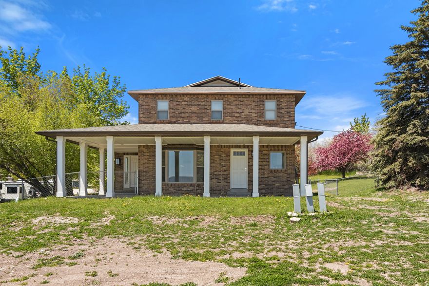 Welcome to this hidden gem in Garden City on over 1 acre of land! Short term rental approved and comfortably sleeps 24. A true turn key property! All furniture, TV's and airbnb essentials are included. This spacious 4-bedroom, 3-bathroom home offers the perfect blend of comfort and adventure. Located on a private drive, this property offers ample space for family gatherings, relaxation and recreation. Inside, you'll find a bright and airy living space, perfect for entertaining friends and family. The kitchen features modern appliances and plenty of counter space for meal preparation. Retreat to the cozy bedrooms after a day of exploration. The real gem of this property lies outside. With room for 3 RV or trailer with full hookups, you can easily accommodate guests or indulge your love for outdoor living. Easy access to a wealth of outdoor activities, from boating on Bear Lake to hiking in the nearby mountains. Don't miss your chance to make this stunning property your own oasis in the heart of nature!