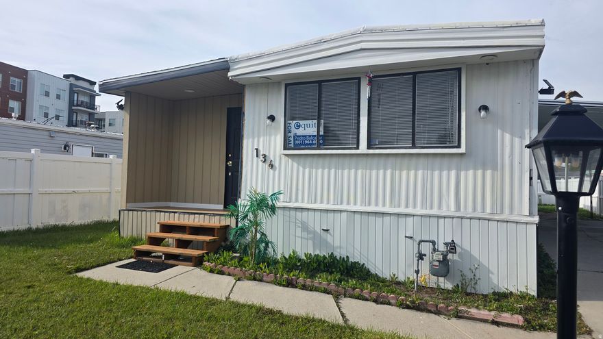 Perfect starter home awaits you in Sandy!  Location! Location! Location!    Central A/C!  The home features 2 bedrooms and 2 bathroom with a bright open-concept living area and a generously sized kitchen, perfect for every day living area and entertaining.  The property also offers potential to add another bedroom and bathroom, giving buyers the opportunity to customize and add value Don't miss this opportunity. The property is being sold as is.  Affordable & Flexible Financing: Manufactured homes offer incredible value-and now with easy, more affordable financing, contact me for more information.