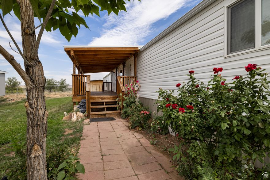 This updated mobile home has much to offer. Starting on the outside, a porch was added in 2022. The siding on the exterior was replaced in 2022 and gutters were added in 2023. The shed was built in 2020. Although the home can be moved, there is landscaping that has been done. In the interior, all cabinets, bathrooms, carpets, and closets were redone in 2018. The carpet was JUST redone again along with the paint and baseboards. An almost-new stove was added as well as a new refrigerator in 2025. A new range hood has just been installed too. Underneath the home, insulation was added in 2018. Buyer to verify all information, square footage estimated and provided as a courtesy. Future residents will need to submit an application to East Meadows. Lot rent is $480 a month and covers sewer, water and trash.