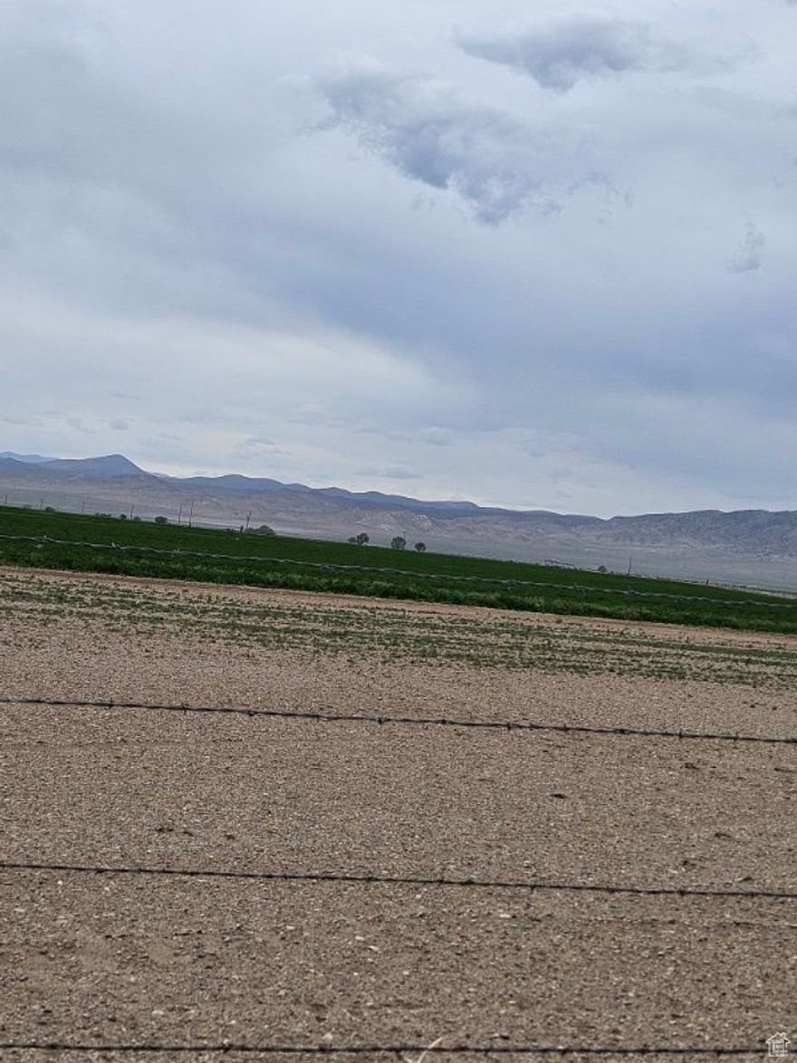 This lot features 40 acres zoned Agriculture/Green Belt and Grazing with beautiful mountain views and fenced.  Front access is paved and power is available. No HOA. Owner will carry short term.