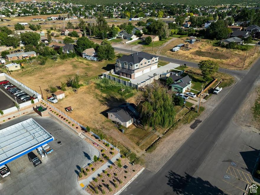 This property has been zoned to MSC - Main Street Commercial. 1 block from the freeway.  It borders Holiday Convenience store on the south side. It is 0.47 acre for ample parking! It has residential water and residential sewer hook-ups, gas, power, and secondary water.  Please contact Santaquin City for what you might like to do with this property and ask about the New Santaquin Main Street Interchange!  This property is vacant and easy to show.  Please call us any time!