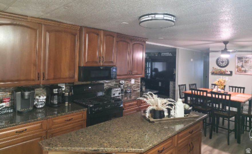 The WOW Factor! 2025 Remodel in Premier 55+ Community. Prepare to be impressed by this beautifully reimagined 1,456 sq. ft. home! Located in a highly sought-after senior community, this 3-bedroom, 2-bathroom residence has the ultimate WOW factor following a complete 2025 transformation. Step into a fresh, modern interior featuring new paint, new flooring, and designer lighting throughout. The stunning kitchen is a showstopper with granite countertops and a suite of brand-new 2025 appliances. Total peace of mind is included with a new roof (2025), new water softener, new washing machine, newer windows (2019), and a 2021 water heater. Outside, enjoy two spacious covered decks and convenient covered parking. This is high-end, turn-key living in a quiet, premier location-truly a must-see!