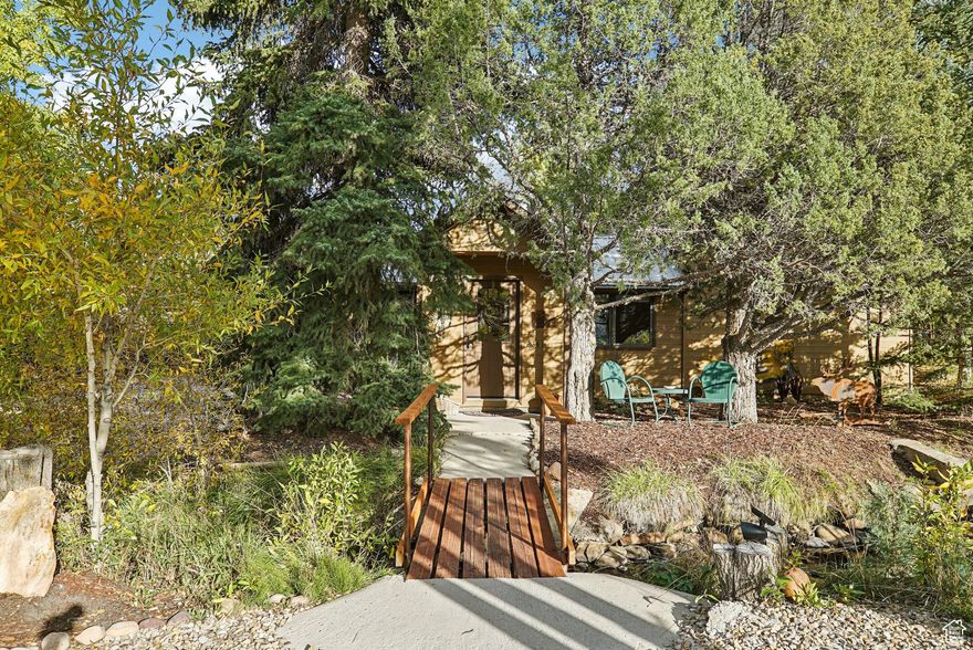 Great home with a comfortable floor plan and lots of windows. Primary bedroom is the entire upstairs with a large walk-in closet & full bath.  Kitchen/dining area has hewn hardwood floors. The living room has a beautiful wood-built-in entertainment center