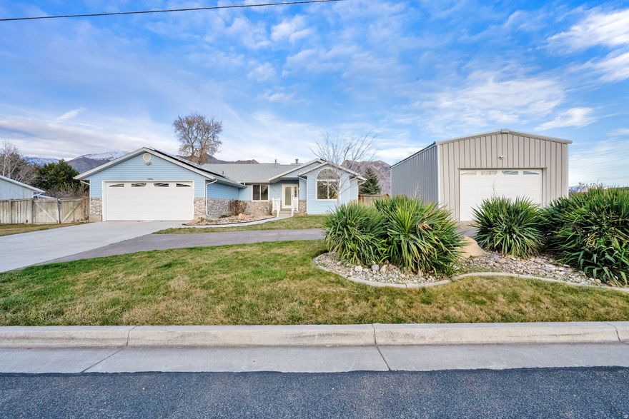 Welcome home to this beautiful property where comfort and space come together.  Inside, you will love the spacious bedrooms and inviting family rooms that provide plenty of room to relax, unwind, and entertain.  This home offers great flexibility, including a separate basement entrance with endless possibilities.  The 720 sq ft dream detached garage is a rare find and ideal for car lovers, hobbyists, or anyone needing extra space.  Step outside nd enjoy peaceful mornings in the backyard while taking in the stunning mountain views and breathtaking sunrises that make this location truly special.