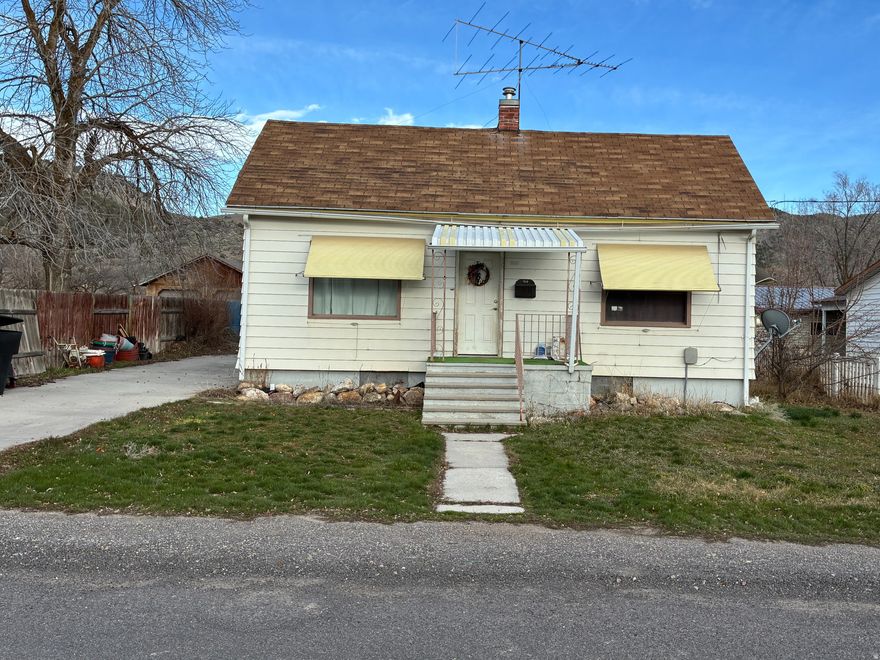 Located on a quiet street in the heart of Malad, make this unique home your own! 3 Bd, 1.75 Bath house is being sold As-is and has a lot of potential! This great property has ample space of .5 acres, fruit trees, partially fenced, garage with attached 16x15' work shed and additional 12x12' building for all your projects.  Must see to appreciate!  Home is within walking distance to park, shopping and restaurants. Square footage figures are provided as a courtesy estimate only and were obtained from county .  Buyer is advised to obtain an independent measurement.