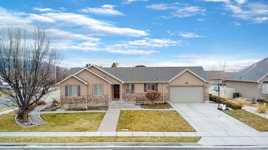 This well-maintained, fully-finished rambler is located in a quiet North Ogden neighborhood. Step inside to a spacious, open floor plan highlighted by vaulted ceilings and a cozy gas fireplace in the great room. The layout flows seamlessly into the kitchen, featuring new appliances and a picturesque view of Ben Lomond Peak from the window above the sink.  The spacious primary suite features a large soaking tub and a walk-in closet for added comfort and convenience. Downstairs, the fully finished basement is designed for entertaining, complete with a built-in entertainment center, gas fireplace, and surround sound for the ultimate movie or game night experience. Step outside to relax on the deck and enjoy the fully landscaped yard with breathtaking mountain views. Additional highlights include a new roof and seamless gutters in 2025, a fully fenced backyard, shed, JellyFish permanent lighting, alarm system, nectarine and pear trees and a smokeless fire pit.  Don't miss this exceptional home-call today to schedule your private showing!