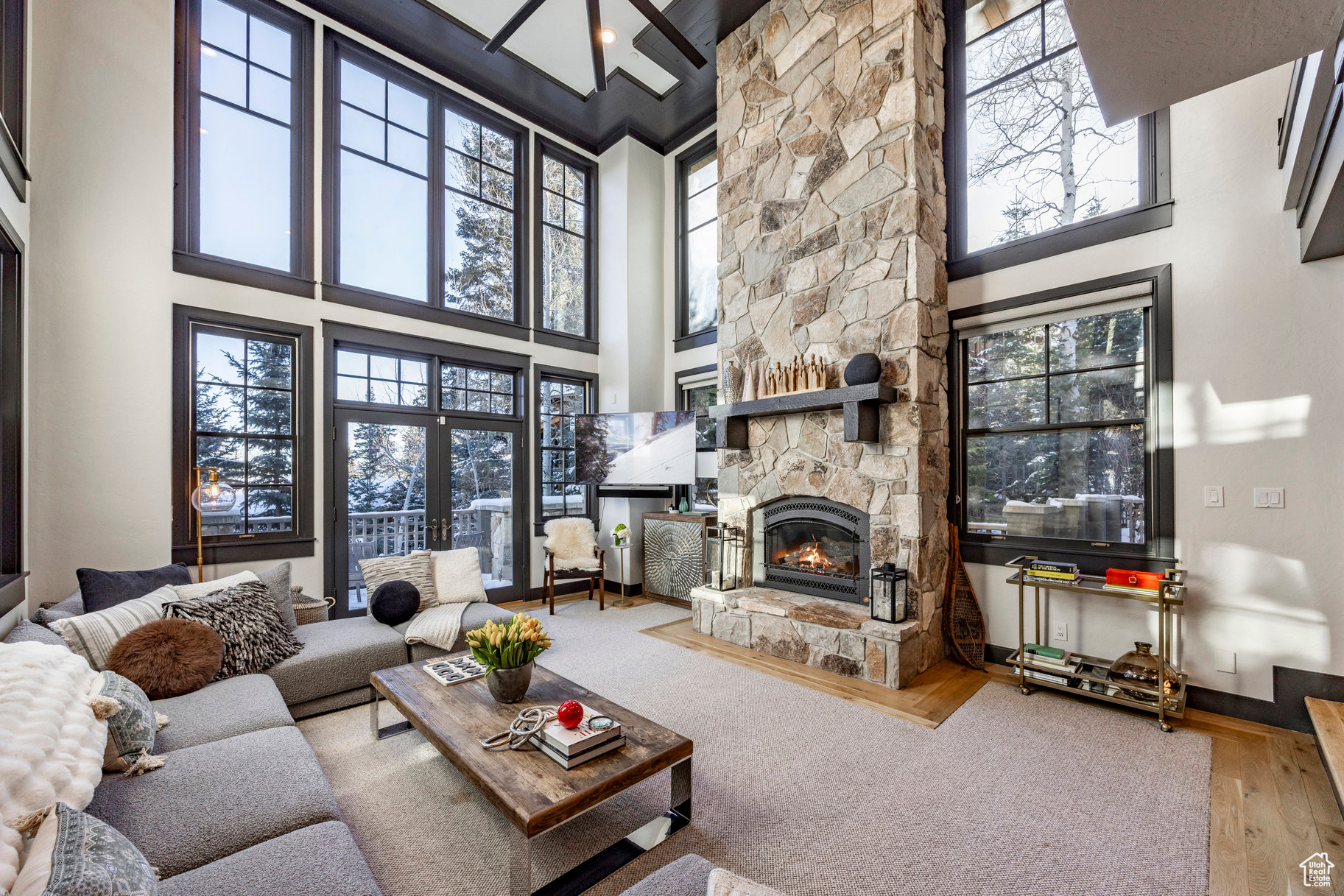 If you're looking for a rare opportunity to own a ski-in ski-out single family residence in the Upper Core of the Canyons Village, where nightly rentals are allowed-supported by strong rental history and low HOA dues-this fully re-imagined mountain getaway combines investment potential with the ability to create a lasting retreat for family and friends. Perfectly positioned on one of only three exclusive homesites in the private, wooded enclave of Dutch Draw, you'll enjoy direct ski-in access via the Retreat Ski Run, with convenient ski-out access to one of the most exciting upgrades in Canyons Village-the new 10-person Sunrise Gondola, currently under construction and set to debut in time for the 2025/2026 ski season. Meticulously updated to blend modern sophistication with warm mountain charm, this light-filled retreat offers a timeless, welcoming design. Ideally located just minutes from the Upper Core of Canyons Village, you are a short walk to summer concerts, hiking and biking trails, championship golf, outdoor dining and a vibrant calendar of seasonal events - along with world-class skiing and pare-ski gatherings during the winter months. The main level is centered around an open living space featuring a striking stone fireplace, tall ceilings, and expansive windows. The dining area, with seating for eight, connects to a private patio surrounded by mature trees, while the fully remodeled chef's kitchen includes state-of-the-art appliances, custom cabinetry, and a large island with seating for seven. A functional mudroom, guest suite with an ensuite bath, and an additional guest room with a nearby 3/4 bath complete this level. Upstairs, a bright landing with built-ins and an office nook leads to two private retreats: a spacious primary suite with a fireplace and seating area, and a guest bedroom with an ensuite bath. The lower level is designed for gathering, with a family room, wet bar, pool table, and a state-of-the-art movie theater. A covered patio with a hot tub, a spacious bunk room, and another ensuite guest bedroom complete the space. Five of the six bedrooms include ensuite bathrooms, three featuring luxurious stand-alone tubs. Generous decks and balconies offer easy indoor-outdoor living. Two laundry rooms, a three-car garage, and a heated driveway ensure comfort and convenience year-round. Located just 35 minutes from Salt Lake International Airport and 10 minutes to Historic Old Town Park City, this unique mountain home offers the rare combination of prime ski access, proven rental performance, and long-term growth potential in one of Park City's most dynamic resort areas.