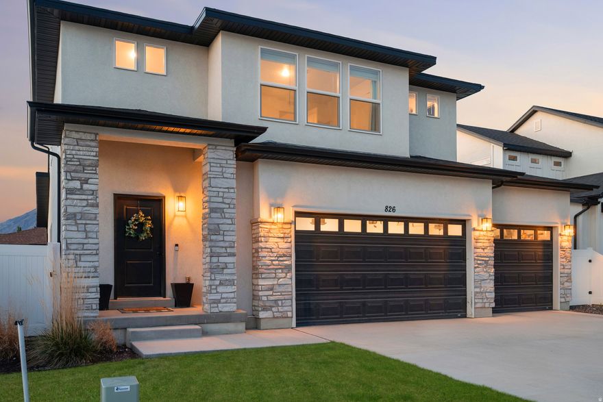 GRAND OPENING | OPEN HOUSE | SATURDAY 12-2PM  Your dream home in beautiful Mapleton just hit the market! This modern, almost new home offers FOUR BEDROOMS + A LOFT,  a 3-CAR GARAGE perfect for your toys and tools, and a MAIN-FLOOR PRIMARY BEDROOM. We can almost smell the grill heating up for summer cookouts in the FULLY FENCED BACKYARD with an oversized concrete pad. The smartly designed floor plan offers an expansive entryway, MUDROOM, and an expanded open-concept GREAT ROOM. When building this home a few years ago, the sellers thoughtfully selected about $90,000 WORTH OF UPGRADES, details that make living and moving through a home feel easy. Structural upgrades include 9-FOOT CEILINGS, an expanded (pop-out) gathering area, and the third car garage with premium EPOXY GARAGE FLOORING. Saturday morning pancakes are coming right up in the UPGRADED KITCHEN, featuring higher-end cabinets and sink, stainless appliances, canned lights, and a nice big pantry. The SPACIOUS PRIMARY BATHROOM, offering dual sinks and a spacious walk-in closet will be your perfect place to relax. The UPGRADED WINDOWS and ADDED INSULATION (including in the garage) support energy efficiency. The neighborhood is perfect, with a huge park and bike pump track being built, as well as easy access to ATV trails and a paved walking trail. Mapleton is an idyllic mountainside community with stunning, almost unreal mountain views. It has a small-town, rural feel, but you will still be close to modern conveniences like schools, medical centers, shopping, and dining. Mapleton is ideal for those who love hiking, biking, and horseback riding, thanks to its plentiful parks and trails. The nearby Spanish Fork Canyon offers fishing, camping and hot springs. Lets get you into this beautiful, modern, and well-appointed home ASAP.  Contact the listing agents or your favorite local Realtor for a private showing or we will see you at the open house!  *All information including square footage figures are provided as a courtesy estimate only. Buyer advised to independently verify all information.