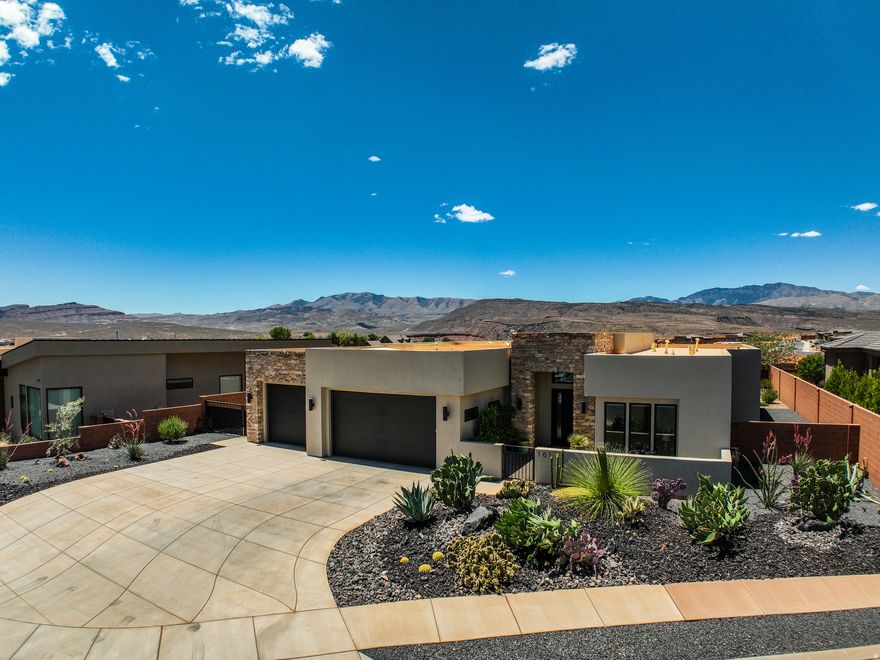 Exceptional home in a highly sought-after newer community in Ivins, surrounded by breathtaking red rock and desert views. Thoughtfully designed, this home features striking fireplaces in both the great room and private casita, creating warm and inviting living spaces. The open-concept kitchen flows seamlessly into the spacious dining and living areas, perfect for entertaining or everyday comfort and easy access to the backyard patio w/automatic climate shades and complete with a firepit and tranquil water feature. Enjoy close proximity to scenic hiking and biking trails, Tuacahn, Kayenta, and Snow Canyon State Park. Beautiful finishes, multiple additional built in cabinets, quality craftsmanship, and an unbeatable location make this home a rare opportunity.