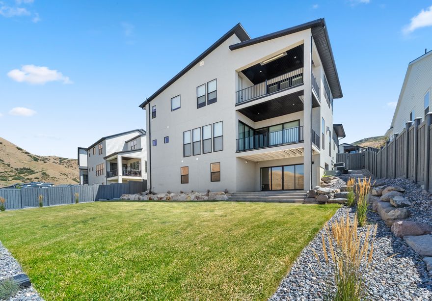 Introducing the One-of-a-Kind Porter Modern Model by Toll Brothers,  A High-Tech Masterpiece in the Prestigious Canyon Point Community of Lehi, Utah. This extraordinary residence showcases over $450,000 in premium upgrades, blending cutting-edge technology with luxurious design and breathtaking panoramic views over Lehi Valley. Boasting 6 spacious bedrooms and 4.5 beautifully appointed bathrooms, this home is thoughtfully designed for both comfort and elegance. The fully finished basement provides additional versatile living space-perfect for entertaining, a home gym, theater room, or guest quarters. A 3-car garage offers ample space for vehicles, storage, and gear. From the moment you enter through the striking 52" custom Vision Makers front door, you'll be greeted by modern sophistication and exceptional craftsmanship. The gourmet kitchen features Sub-Zero refrigeration, gas appliances, a built-in double oven, and luxury finishes, ideal for hosting or everyday living. The main-level great room is centered around a stunning 60" Mezzo linear fireplace and opens seamlessly to a spacious covered balcony via expansive multi-panel sliding glass doors. Enjoy outdoor heating and year-round use with uninterrupted panoramic views. The primary suite is a showstopper, featuring its own private second-level balcony, also with multi-panel sliders and outdoor heating, offering elevated views across the valley-perfect for morning coffee or evening sunsets. Additional upgrades include: Custom designer lighting throughout, Automatic shades, Wi-Fi, enabled lighting system, Soft water system, Tankless water heater, All controlled through a CONTROL4 Smart Home Automation System, giving you full command over lighting, entertainment, climate, and security-right from your phone or tablet. Ideally located with quick access to I-15, top-rated schools, shopping, and the Silicon Slopes tech corridor, this home combines smart living with timeless luxury. Don't miss your chance to own one of Canyon Point's most stunning homes. Square footage figures are provided as a courtesy estimate only and were obtained from county record.  Buyer is advised to obtain an independent measurement.