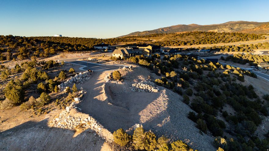Quite simply the best building lot available in Cedar City right now - possibly ever! Two lots combined for over an acre in one of the most exclusive neighborhoods, with stunning 180 degree views of the mountains & Shurtz Cyn. Extensive grading and site prep is already done giving you a long driveway down to a building pad that feels perched on a high point in the neighborhood. Wide enough for an expansive home with views in every room, this gorgeous lot has utilities, & sits on quiet cul-de-sac. Giant boulders from the site have been used to screen the lot from the street and line the driveway, providing the framework for future landscaping. Water meter to be set at the time of building permit, but water lines already run through the site. DON'T WAIT - this is too special for you to miss!