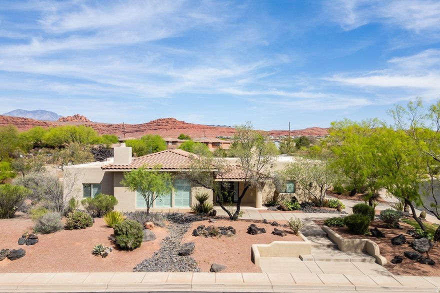 Nestled in the highly sought-after Lava Cove enclave of Entrada Country Club, this former Parade of Home offers the perfect blend of luxury and comfort. This residence was remodeled and upgraded in 2020, with refined finishes and timeless design throughout. The spacious, open concept layout features a large kitchen, dining, and living area, ideal for entertaining family and friends. A striking Kiva fireplace adds warmth and character, while wood flooring, plantation shutters, and custom blinds throughout the home create an elegant and cohesive feel. The outdoor living spaces are equally impressive, featuring a large back patio perfect for relaxing or hosting gatherings, low-maintenance turf in the backyard, an inviting front patio, and mature landscaping that enhances both privacy and curb appeal. Residents enjoy exclusive access to the private clubhouse featuring a full-service restaurant, two sparkling pools, two hot tubs, pickleball courts, and a fully equipped fitness center. A full schedule of exercise and wellness classes provides opportunities to stay active and connected year-round. Ideally located just minutes fromSnow Canyon State Park,Tuacahn Amphitheatre, andBlack Desert Resort, this home offers convenient access to hiking, world-class performances, golf, dining, and luxury amenities. In addition, you are within a short drive to some of the Southwest's most iconic destinations, includingZion National Park,Bryce Canyon National Park, andGrand Canyon National Park. Experience the best of Southern Utah living in a serene, beautifully maintained setting surrounded by stunning red rock landscapes.